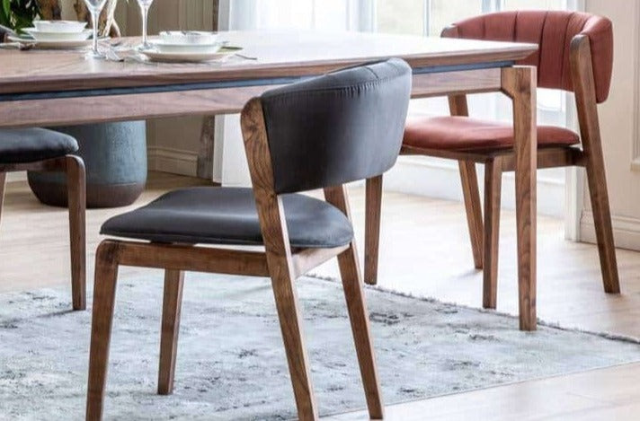 Maserati dining chair by Netline Home Interior with a modern design, upholstered seat, and wooden legs for stylish dining room decor.