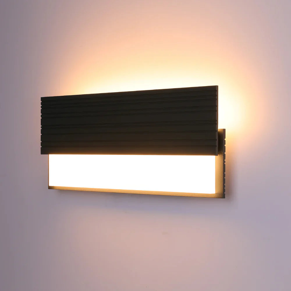 Netline Home Interior Monolith LED outdoor wall light, 20W, 3000K, providing ambient accent lighting on exterior walls.